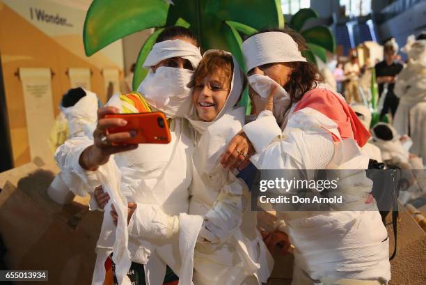 Family takes a selfie at Powerhouse Museum on March 19, 2017 in Sydney, Australia. A total of 846 people wrapped themselves in toilet paper to set...