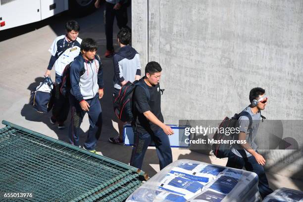 Infielder Ryosuke Kikuchi and Outfielder Yoshitomo Tsutsugoh and Outfielder Ryosuke Hirata of Japan are seen on arrival at the stadium prior to the...