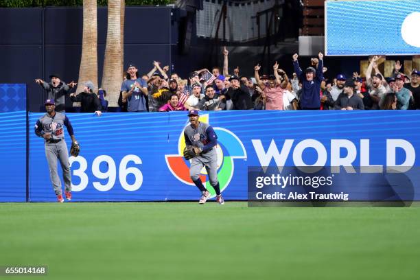 Adam Jones of Team USA reacts after making a leaping catch to rob Manny Machado of Team Dominican Republic of a home run in the bottom of the seventh...