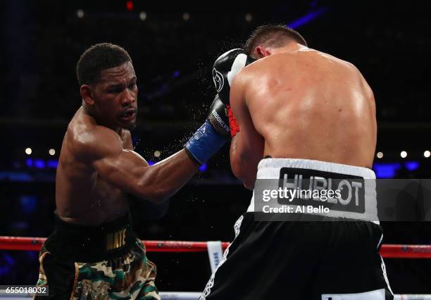 Daniel Jacobs punches Gennady Golovkin during their Championship fight for Golovkin's WBA/WBC/IBF middleweight title at Madison Square Garden on...