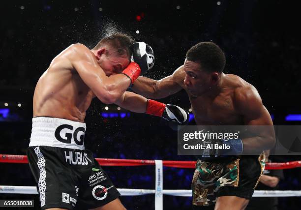 Daniel Jacobs punches Gennady Golovkin during their Championship fight for Golovkin's WBA/WBC/IBF middleweight title at Madison Square Garden on...