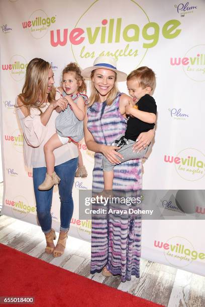 Abigail Ochse and daughter Willow and Julie Solomon and son Camden attend the Grand Opening Party For WeVillage at WeVillage on March 18, 2017 in Los...