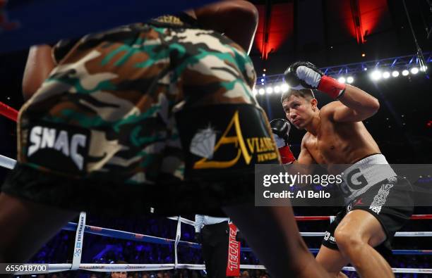 Gennady Golovkin knocks down Daniel Jacobs in the fourth round during their Championship fight for Golovkin's WBA/WBC/IBF middleweight title at...