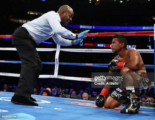 Roman "Chocolatito" Gonzalez is knocked down against Srisaket Sor Rungvisai during their Championship fight for Gonzalez's WBC junior bantamweight...