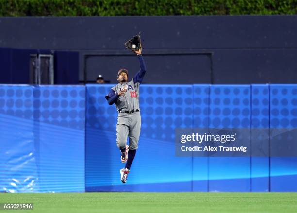 Adam Jones of Team USA catches a fly ball for the second out in the bottom of the ninth inning of Game 6 of Pool F of the 2017 World Baseball Classic...