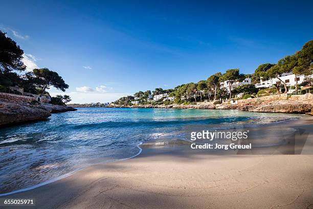cala d'or beach at sunrise - beach at cala d'or stock pictures, royalty-free photos & images