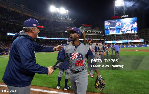 Coach Jeff Jones shakes hands with Andrew McCutchen of Team USA after Game 6 of Pool F of the 2017 World Baseball Classic against Team Dominican...