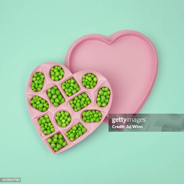 Green peas in a heart-shaped candy box
