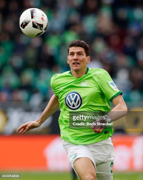 Mario Gomez of VfL Wolfsburg runs with the ball during the Bundesliga match between VfL Wolfsburg and SV Darmstadt 98 at Volkswagen Arena on March...