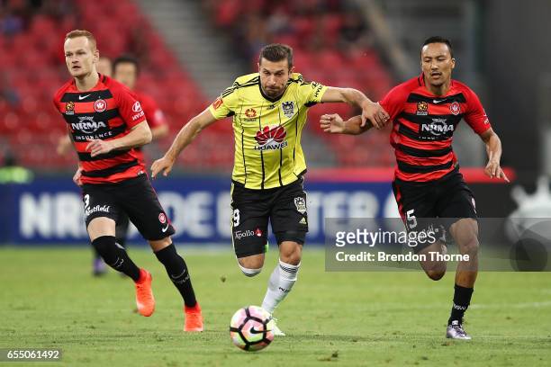 Kosta Barbarouses of the Phoenix competes with Karyn Baccus of the Wanderers during the round 23 A-League match between the Western Sydney Wanderers...