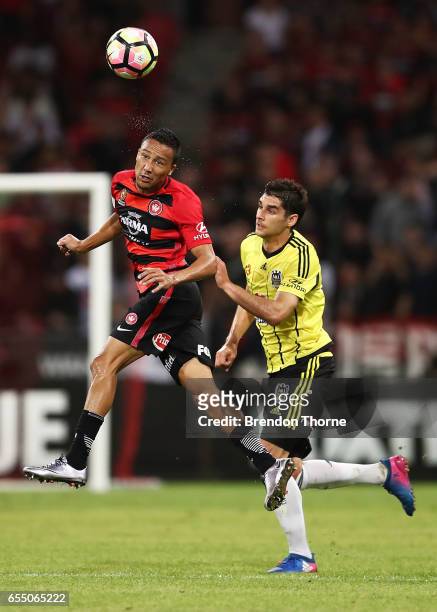 Karyn Baccus of the Wanderers competes with Guilherme Finkler of the Phoenix during the round 23 A-League match between the Western Sydney Wanderers...