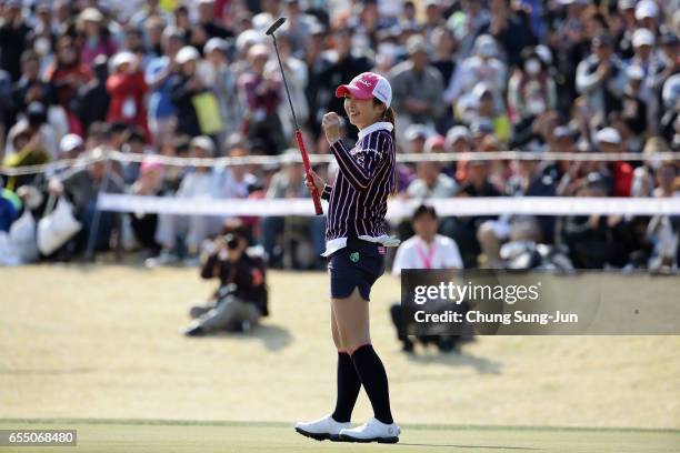 Erika Kikuchi of Japan celebrates after a winning putt on the 18th green during the T-Point Ladies Golf Tournament at the Wakagi Golf Club on March...