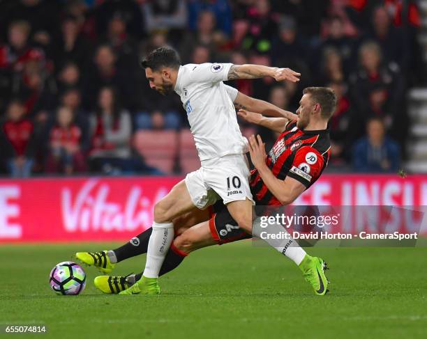 Bournemouth's Simon Francis battles with Swansea City's Borja Baston during the Premier League match between AFC Bournemouth and Swansea City at...