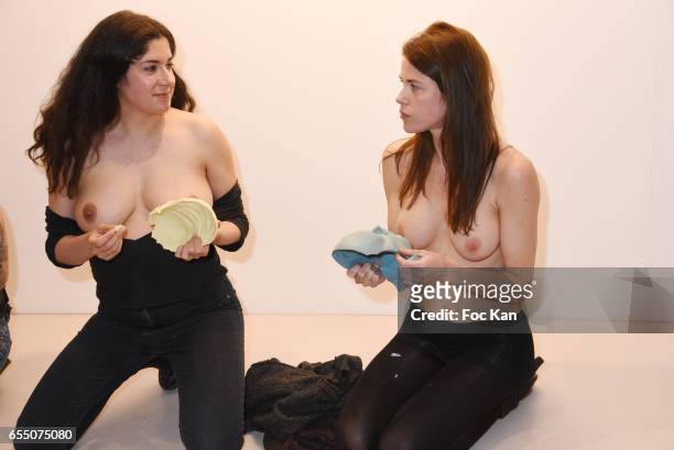 Visual artist Sarah Trouche and actress/model Zoe Duchesne during the 'Faccia A Faccia' Sarah Trouche performance exhibition at Galerie Vanessa Quang...