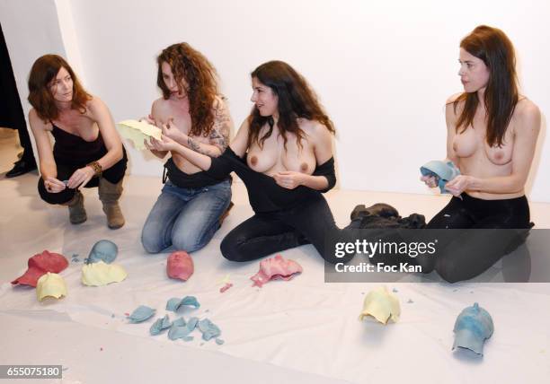 Visual artists Camille Moravi, June McGrane, Sarah Trouche and actress/model Zoe Duchesne perform during the 'Faccia A Faccia' Sarah Trouche...