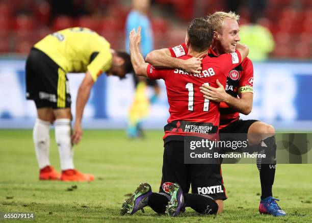 Brendon Santalab of the Wanderers celebrates with team mate Mitch Nichols after scoring his second goal during the round 23 A-League match between...