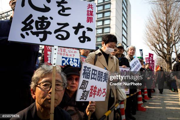 Anti-Abe protesters gather with placards in front of Tokyo parliament during a rally, denouncing his government policies and calling on the Japanese...