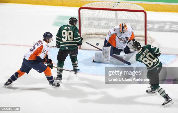 Alex Formenton of the London Knights fires a shot past Connor Hicks of the Flint Firebirds during an OHL game at Budweiser Gardens on March 17, 2017...
