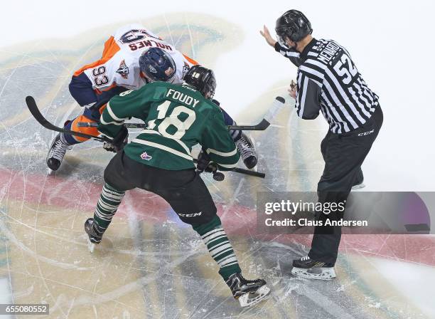 Hunter Holmes of the Flint Firebirds takes a faceoff against Liam Foudy of the London Knights during an OHL game at Budweiser Gardens on March 17,...