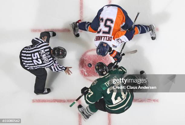 Ty Dellandrea of the Flint Firebirds takes a faceoff against Robert Thomas of the London Knights during an OHL game at Budweiser Gardens on March 17,...