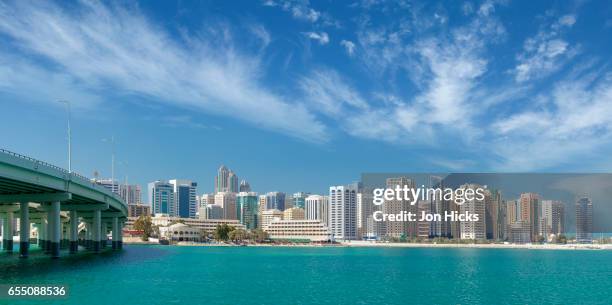 abu dhabi skyline from al maryah island. - al maryah island in abu dhabi stockfoto's en -beelden