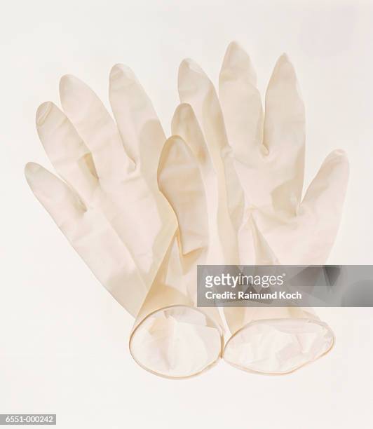 surgical gloves - surgical glove stock pictures, royalty-free photos & images