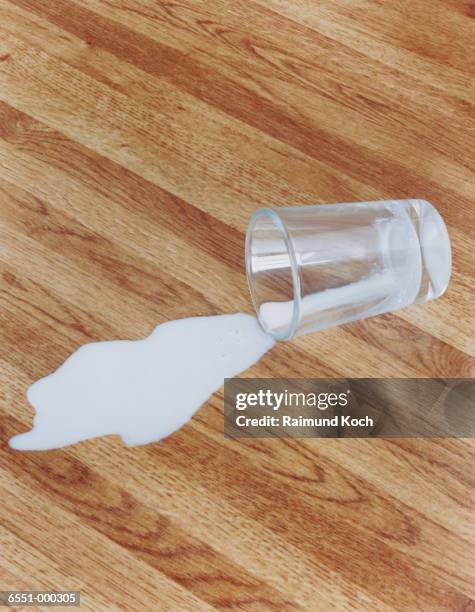 spilled milk - milk puddle stock pictures, royalty-free photos & images