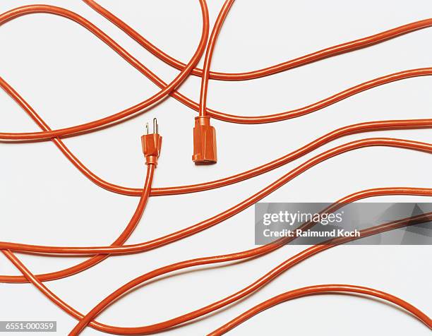 orange extension cord - wire fotografías e imágenes de stock