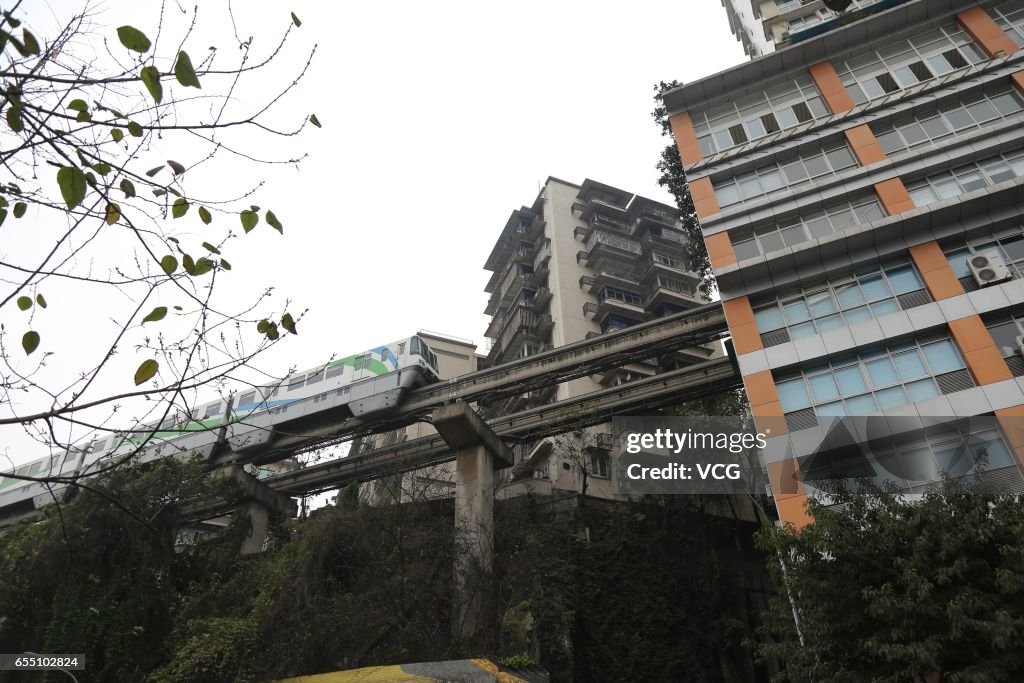 Light Railway Passes Through Residential Building In Chongqing
