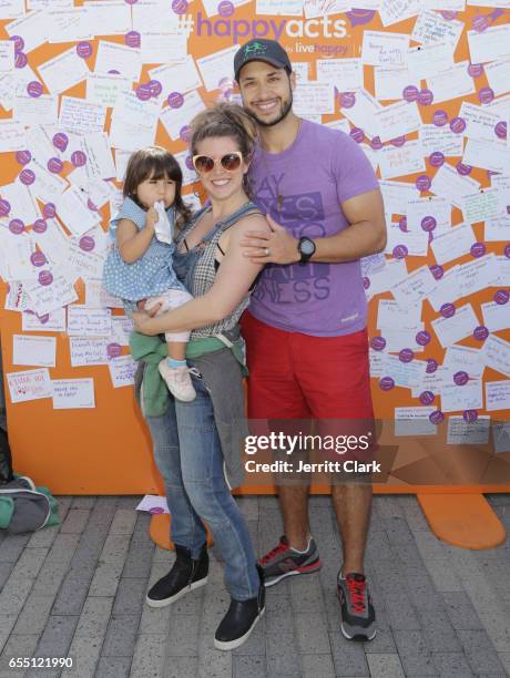 Jaylen Moore wife Britt Logan and daughter Leili attend Live Happy's #HappyActs Event on March 18, 2017 in Redondo Beach, California.