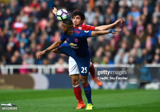 Antonio Valencia of Manchester United and Fabio Da Silva of Middlesbrough battle for possession during the Premier League match between Middlesbrough...