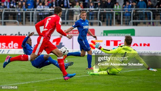 Franck Kom of Karlsruhe challenges Michael Rensing of Fortuna Duesseldorf during the Second Bundesliga match between Karlsruher SC and Fortuna...