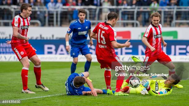 Grischa Proemel of Karlsruhe challenges Michael Rensing of Fortuna Duesseldorf during the Second Bundesliga match between Karlsruher SC and Fortuna...