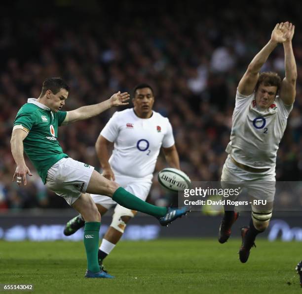 Jonathan Sexton of Ireland clears the ball upfield as Joe Launchbury attempts to charge down during the RBS Six Nations match between Ireland and...
