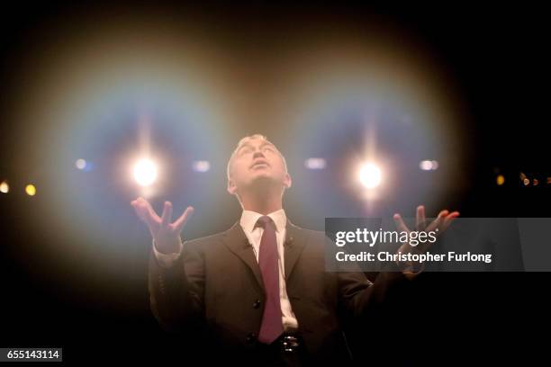 Liberal Democrats party leader Tim Farron delivers his keynote speech to party members on the last day of the Liberal Democrats spring conference at...