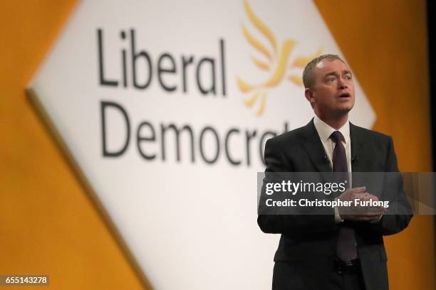 Liberal Democrats party leader Tim Farron delivers his keynote speech to party members on the last day of the Liberal Democrats spring conference at...