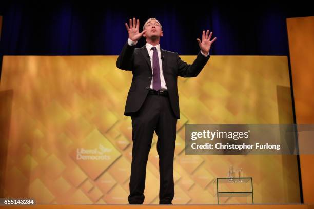 Liberal Democrats party leader Tim Farron delivers his keynote speech to party members on the last day of the Liberal Democrats spring conference at...