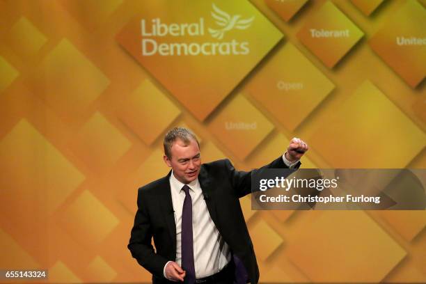 Liberal Democrats party leader Tim Farron delivers his keynote speech to party members on the last day of the Liberal Democrats spring conference at...