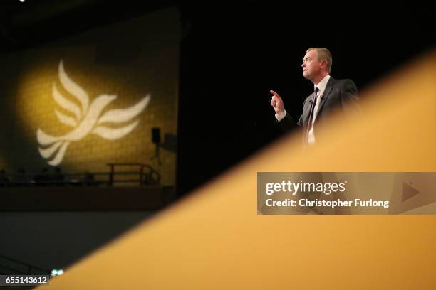 Liberal Democrats party leader Tim Farron delivers his keynote speech to party members on the last day of the Liberal Democrats spring conference at...