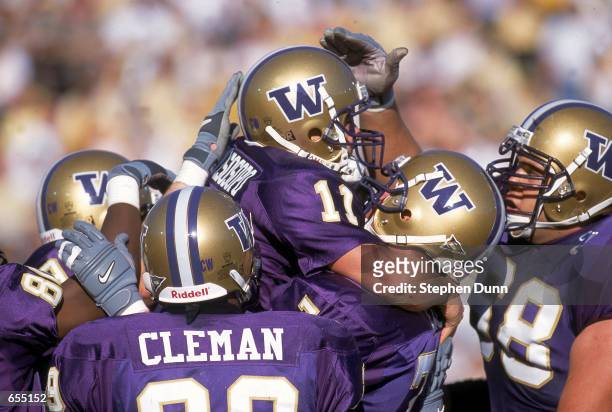 Marques Tuiasosopo, Was Call and Branton Cleman of the Washington Huskies celebrate a touchdown during the Rose Bowl Game against the Purdue...