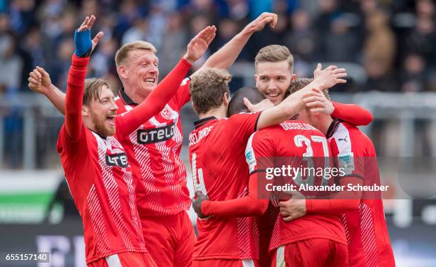 Rouwen Hennings of Fortuna Duesseldorf celebrates the third goal for his team with his teammates during the Second Bundesliga match between...