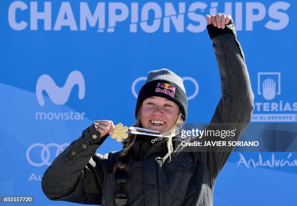 Gold medal winner French freestyler Tess Ledeux celebrates on the podium of the women's SlopeStyle at the FIS Snowboard and Freestyle Ski World...