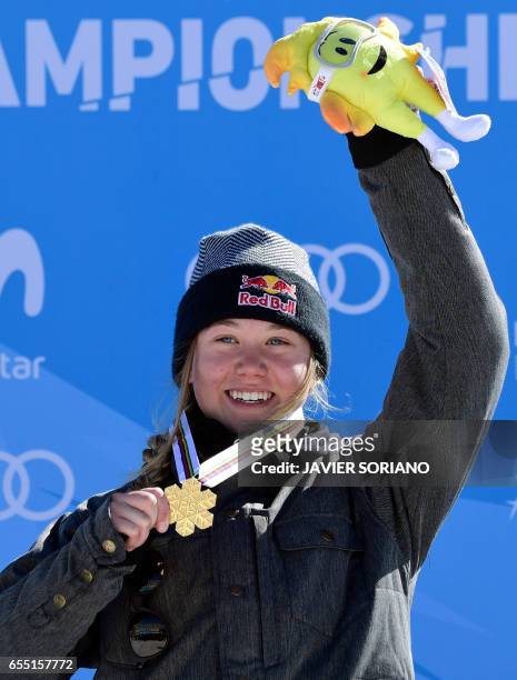 Gold medal winner French freestyler Tess Ledeux celebrates on the podium of the women's SlopeStyle at the FIS Snowboard and Freestyle Ski World...
