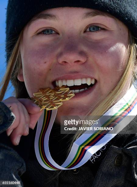 Gold medal winner French freestyler Tess Ledeux celebrates on the podium of the women's SlopeStyle at the FIS Snowboard and Freestyle Ski World...