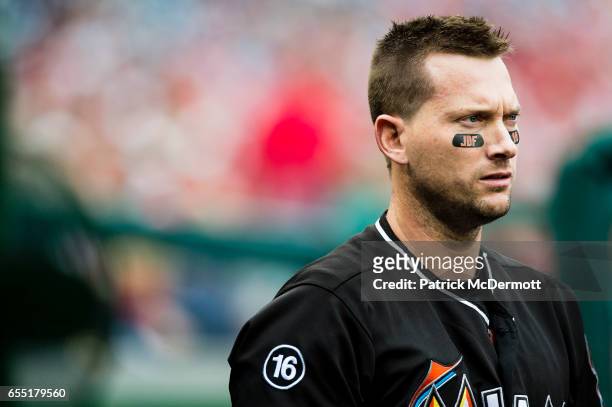 Chris Johnson of the Miami Marlins looks on while showing support for Miami Marlins pitcher Jose Fernandez, who died in a boating accident, in the...
