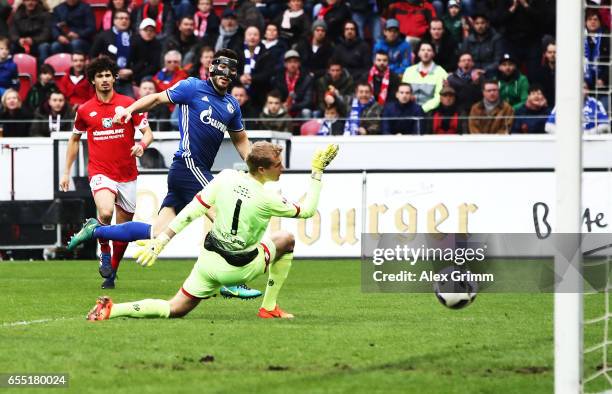 Sead Kolasinac of Schalke 04 scores a goal past Jonas Loessl of FSV Mainz 05 during the Bundesliga match between 1. FSV Mainz 05 and FC Schalke 04 at...