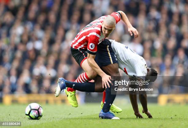 Oriol Romeu of Southampton and Victor Wanyama of Tottenham Hotspur battle for possession during the Premier League match between Tottenham Hotspur...