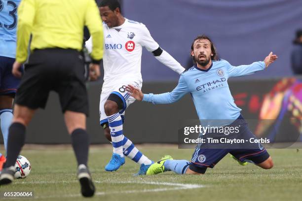March 18: Andrea Pirlo of New York City FC is pushed off the ball by Patrice Bernier of Montreal Impact during the New York City FC Vs Montreal...