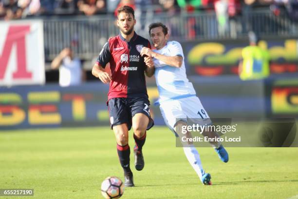 Contrast with Panagiotis Tachtsidis of Cagliari and Senad Lulic of Lazio during the Serie A match between Cagliari Calcio and SS Lazio at Stadio...