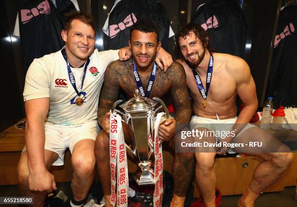 Dylan Hartley Courtney Lawes and Tom Wood of England hold the Six Nations trophy after the RBS Six Nations match between Ireland and England at the...